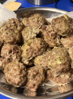 a bowl full of melt in your mouth meatballs